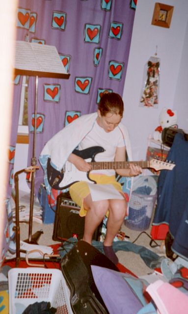 Where's Flounder??...me doing what I enjoy most having a jam session of my guitar!..but just check out my room! it's not always like that!! just most of the time...I'm a busy girl!!!
