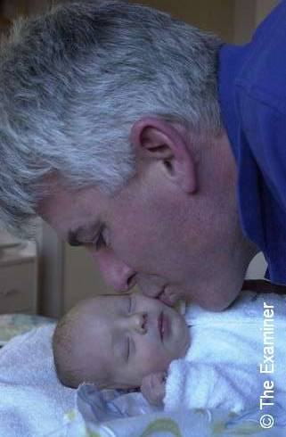 My Uncle Ian with my new cousin Ebony =)
