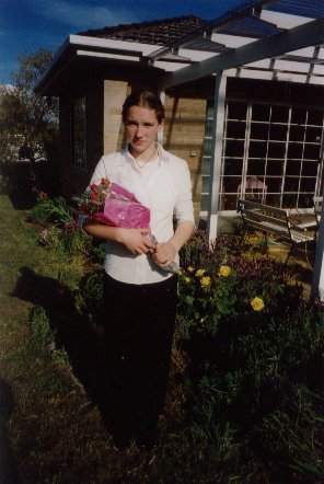 With my flowers I got for playing vioin in our backyard
